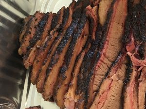 Brisket Slices in Tray | Love and Smoke Barbecue