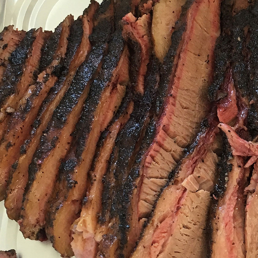 Brisket Slices in Tray | Love and Smoke Barbecue